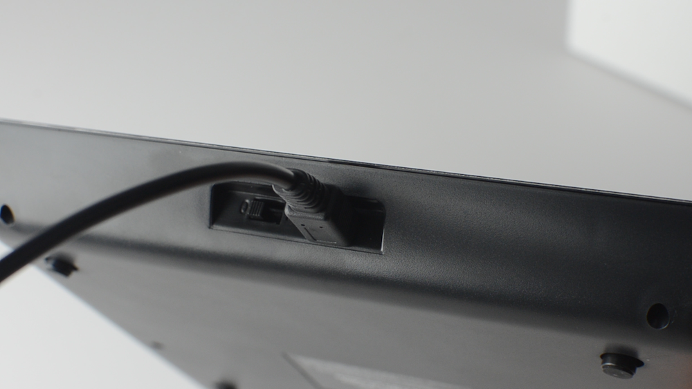 Shows a cord into the back of a USB scale